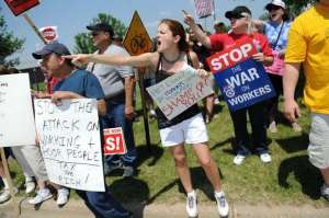 Hundreds protest the signing of the state budget in Green Bay June 27
