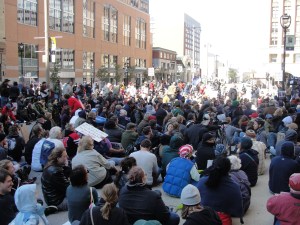 Hundreds sit down in front of M&I Bank in Milwaukee Oct. 15 as part of a Occupy Milwaukee protest.