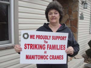 Two Rivers resident and AFSCME Local 1288 Treasurer Lynne A. Pfeifer shows her support for the striking machinists and laid-off boilermakers, Dec. 7, 2011.