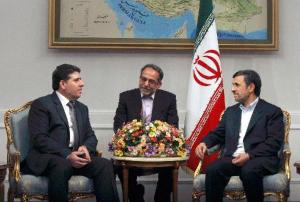Iranian President Mahmoud Ahmadinejad (R) meets with Syrian Prime Minister Wael al-Halqi (L) in Tehran, Iran, Jan. 15, 2013. Ahmadinejad called on Tuesday for enhancing relations with Syria in different fields. (Xinhua/Ahmad Halabisaz)