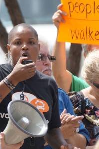 Angela Walker of the Amalgamated Transit Union Local 998 denounces Scott Walker and his Wall Street bosses August 2 at a protest at the National Governor's Association in Milwaukee.
