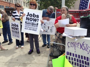 Babette Grunow of the WI Bail Out The People Movement speaks August 3, 2013 at the protest against the National Governor's Association convention in Milwaukee.
