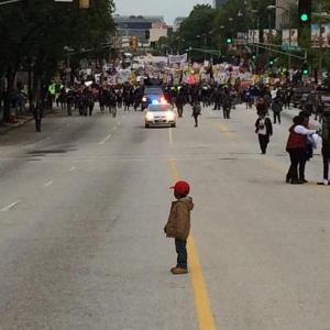 Young Nigel waits for the rest of the #FergusonOctober marchers to catch up. 