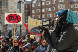 Brandi Grayson of the Young Gifted and Black coalition, speaking to hundreds of protesters at the state capitol in Madison Feb. 14, 2015. Grayson  linked the struggles of the the Black Lives Matter movement and the fights to fully fund public education characterizing both as state violence on the people. [Photo: Joe Brusky]