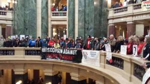 Workers and Community members pack the rotunda at the state capitol in Madison, Feb. 25, 2015. The are demanding "Shut Down RTW!"
